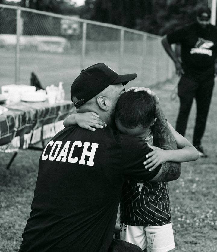 A coach and an athlete after the last game of the season