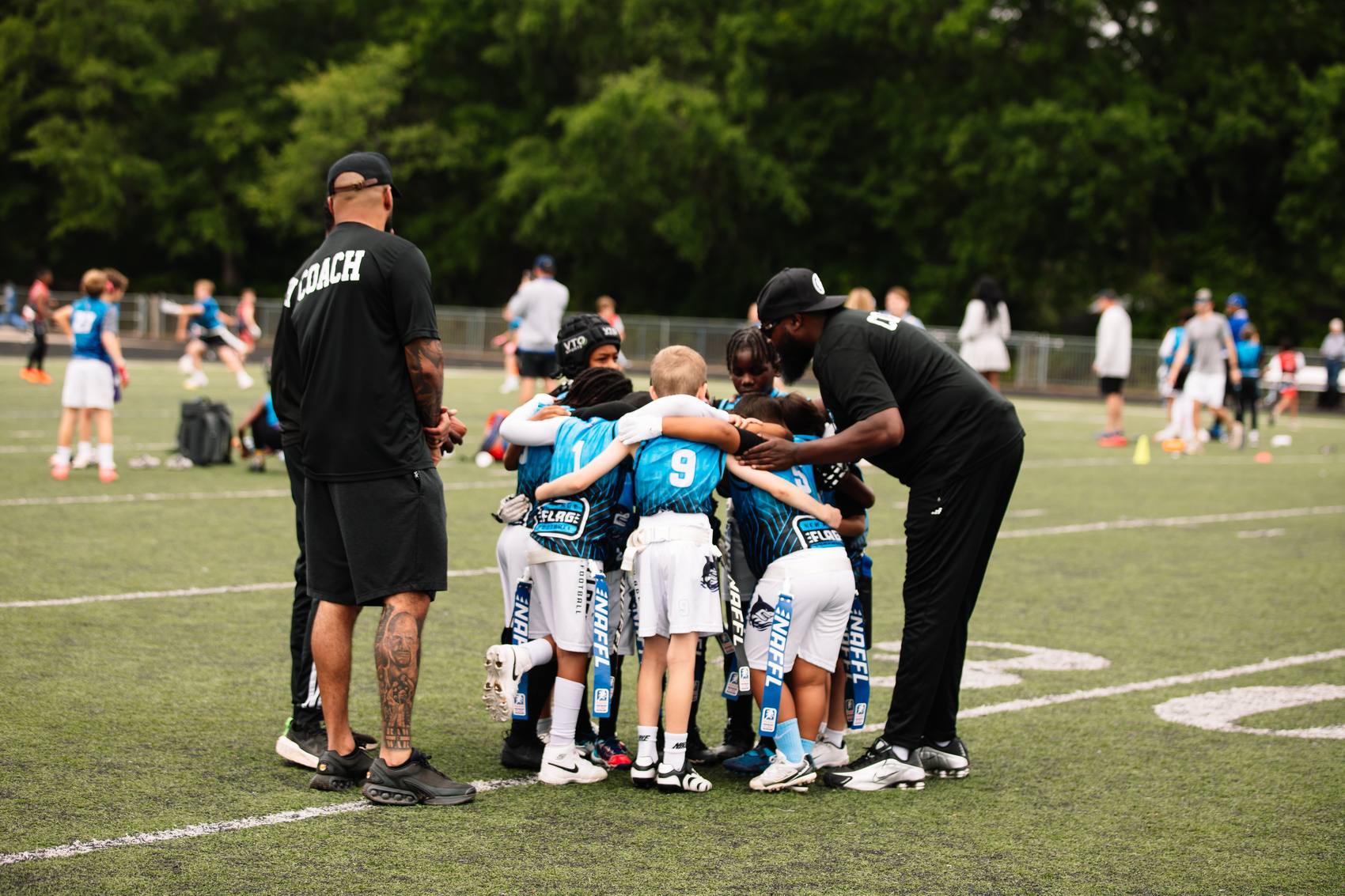 The Sharks huddle up with their coaches