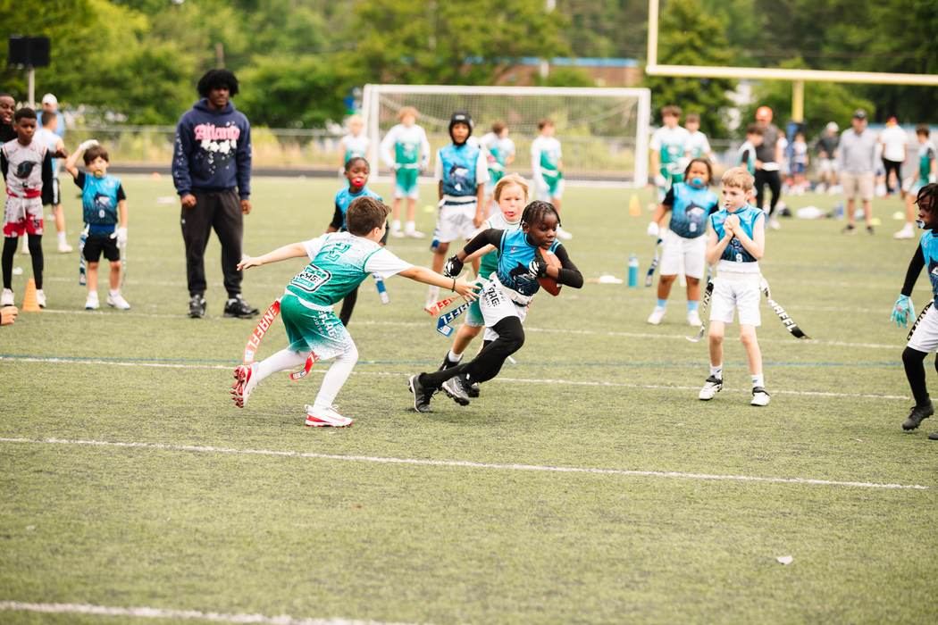 An athlete breaking away up the sideline