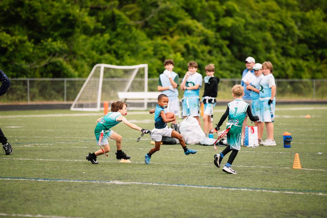 An athlete cutting upfield with the ball